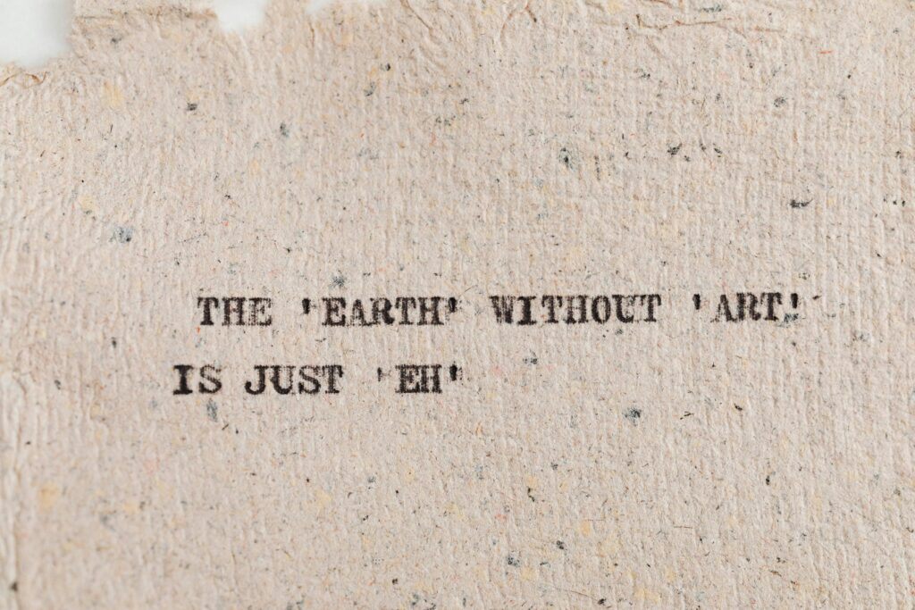 Textured paper with motivational quote highlighting art's importance.